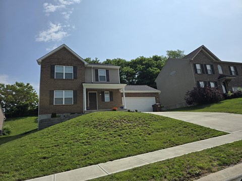 a house with a lawn in front of it